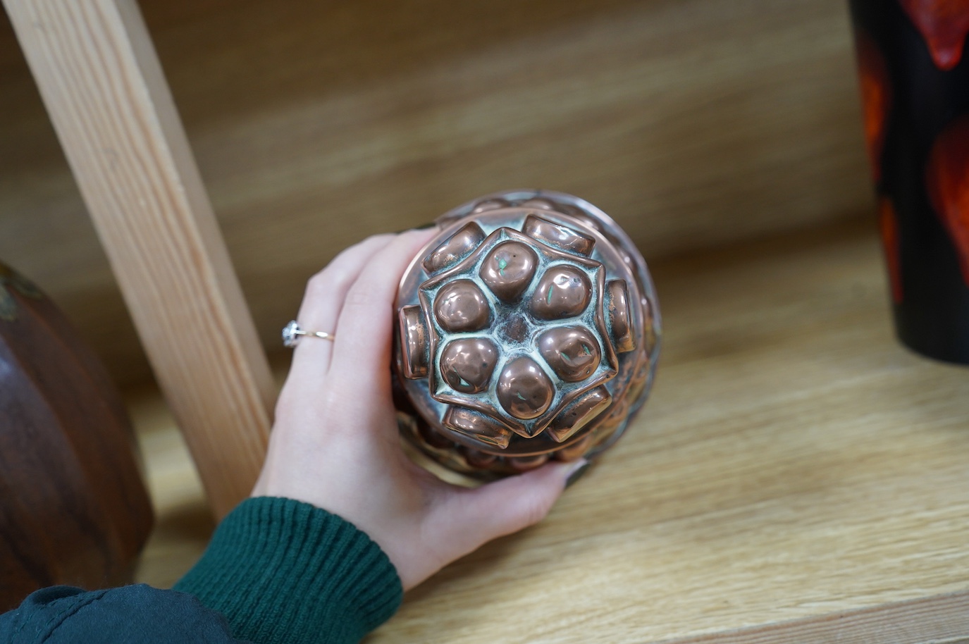 A tall Victorian copper jelly mould, 17cm. Condition - fair